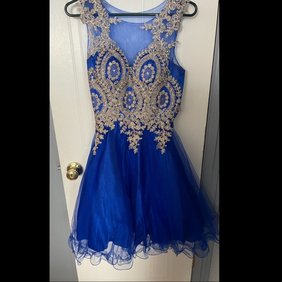 Dresses & Skirts - Blue dress , in a size four , only worn once.